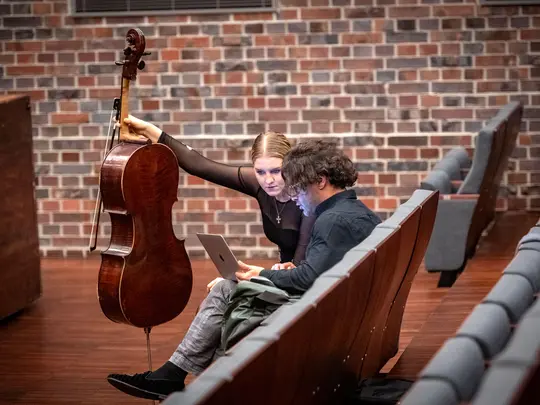 PhD. hab. Bassem Akiki, artistic director of the Academic Symphony Orchestra with a student of AMKL