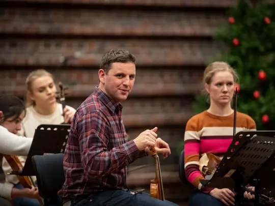 Project coordinator WBB Orchestra and band leader Dr. Paweł Miczka together with orchestra members