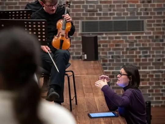 The team leader, Jana An&yacute;žov&aacute;, MA, together with the members of the orchestra