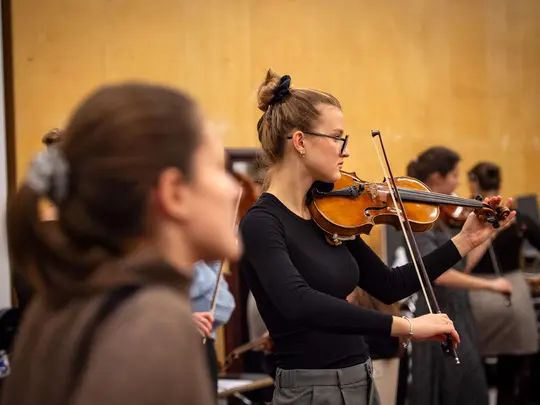 Academic Symphony Orchestra in the orchestra rehearsal room
