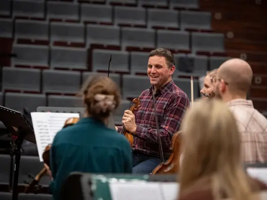 Project coordinator WBB Orchestra and band leader Dr. Paweł Miczka together with orchestra members