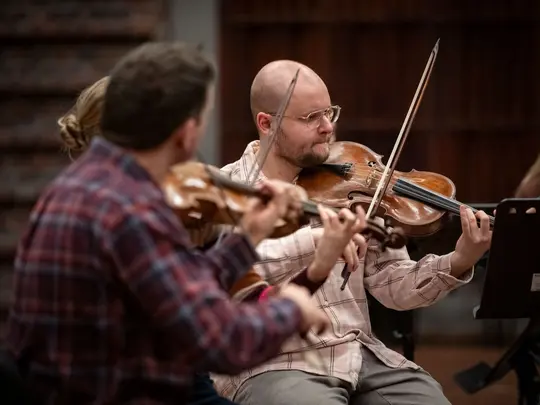 Project coordinator WBB Orchestra and band leader Dr. Paweł Miczka together with orchestra members