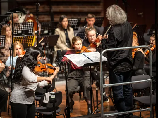 Maestro Marek Pijarowski, Sara Dragan and Academic Symphony Orchestra