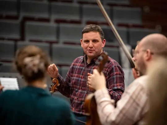 Project coordinator WBB Orchestra and band leader Dr. Paweł Miczka together with orchestra members