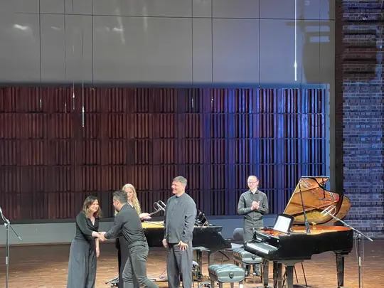 Diana Buffa and Ivan Buffa congratulate Paweł Heinrich, composer of the song Color // Shape // Magnitude