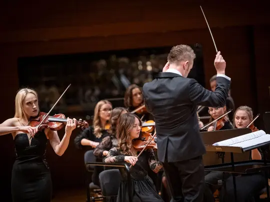 Karolina Podorska, PhD hab. Wojciech Rodek and the Academic Symphony Orchestra