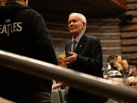 The audience waiting for the concert to begin