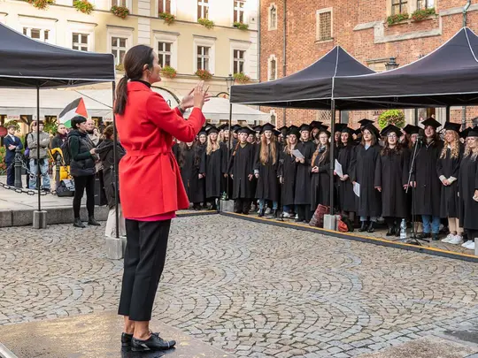 The combined academic choirs of Wrocław universities, conducted by Magdalena Wojtas, perform Gaudeamus igitur